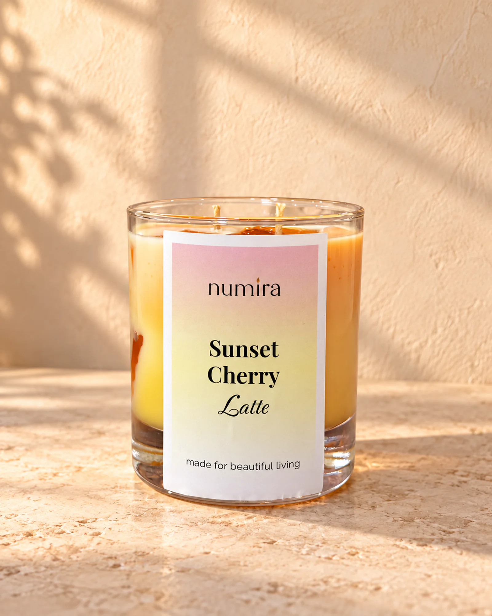 Sunset Cherry Latte tropical scented candle in a clear glass jar
