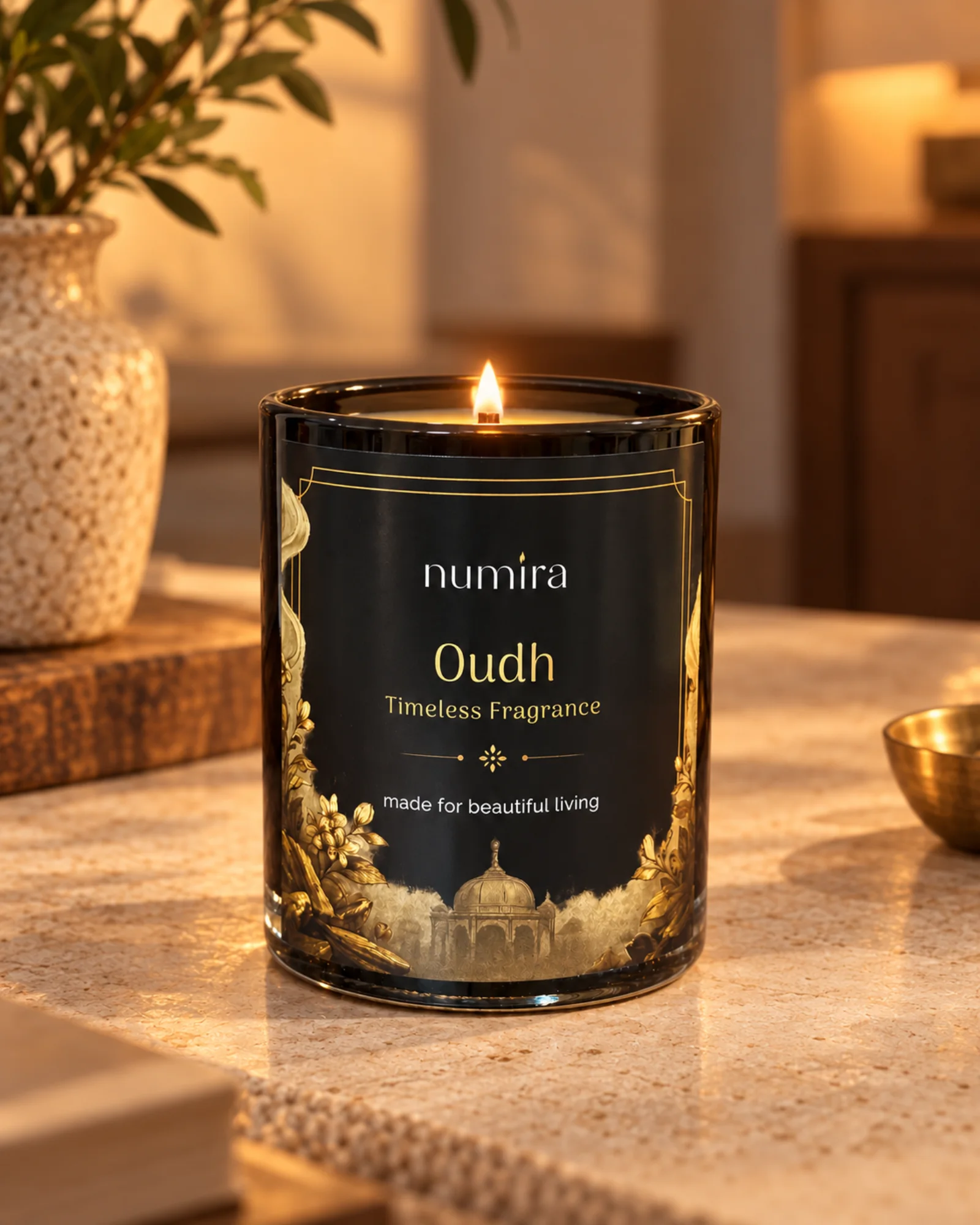 Oudh scented candle lit in a warm lifestyle setting